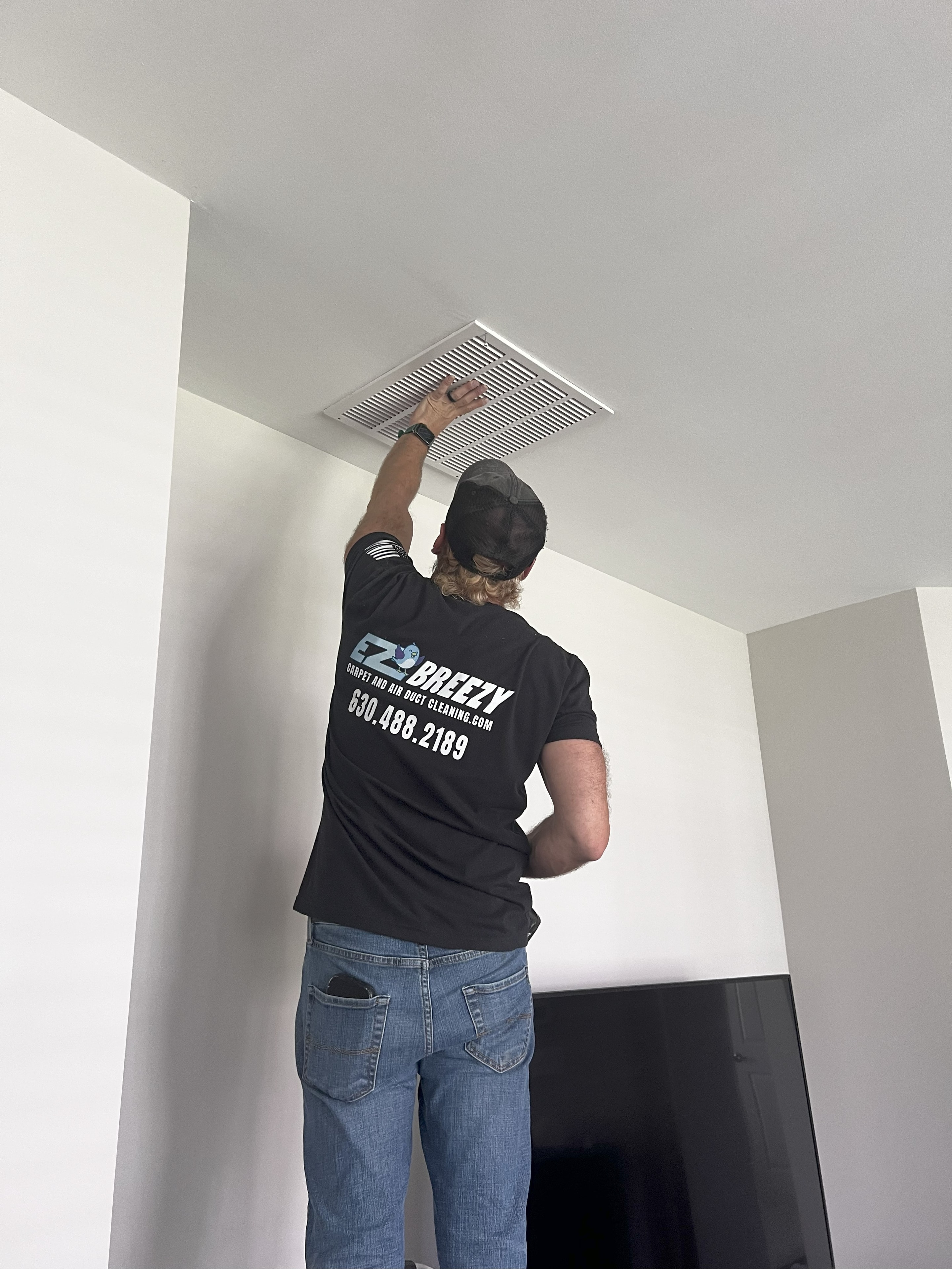 Air duct cleaning in progress — high-powered HEPA vacuum doing the heavy lifting.